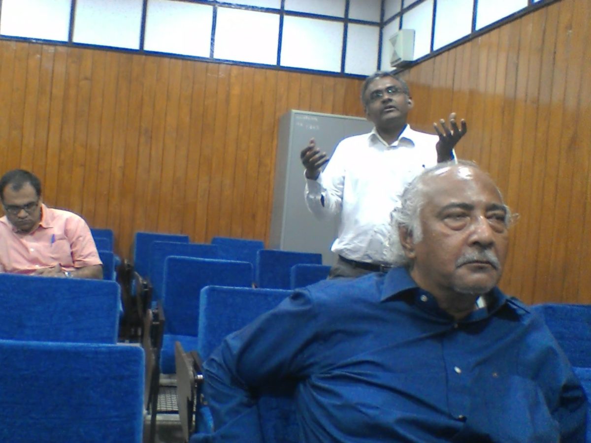 A member of the audience stands to ask a question after a talk at NIMHANS